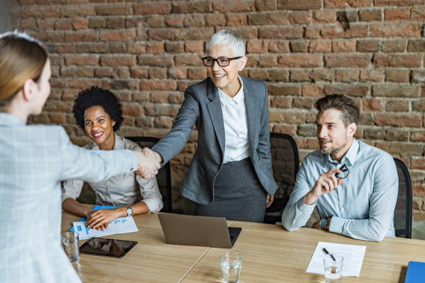 istock Human resource team welcoming a candidate on a job interview. 1212336066