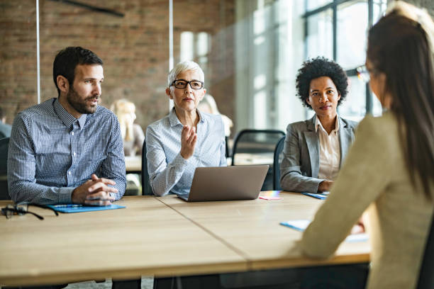 istock Human resource team talking to their candidate on a job interview. 1212336254