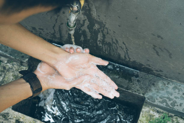istock Asia man washing his hand using liquid soap 1212336387