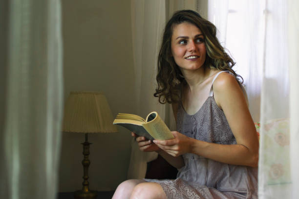 istock Pretty Woman Reading a Book 1212336565