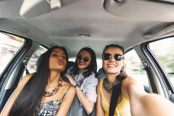istock Happy girl having party in a car 1212336573