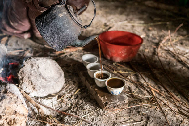 istock Villager pouring coffee, Ethiopia 1212341069