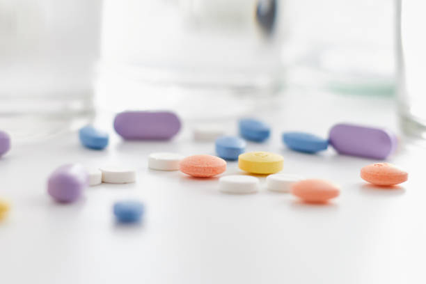 istock medical pills on blur background. 1212343011