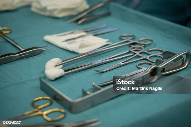 Medical Instruments On A Blue Table Prepaired For Surgery Stock Photo - Download Image Now