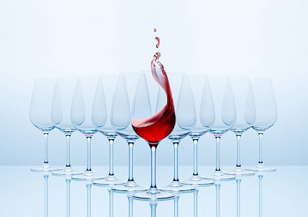 Wine glasses with red wine poured into the front glass