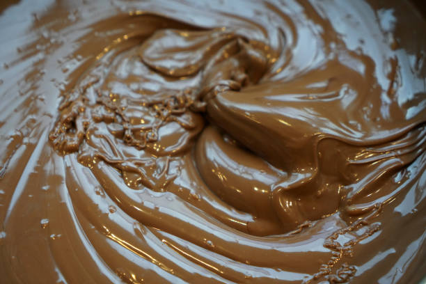 istock Melted chocolate swirl background drawn from top 1212348667