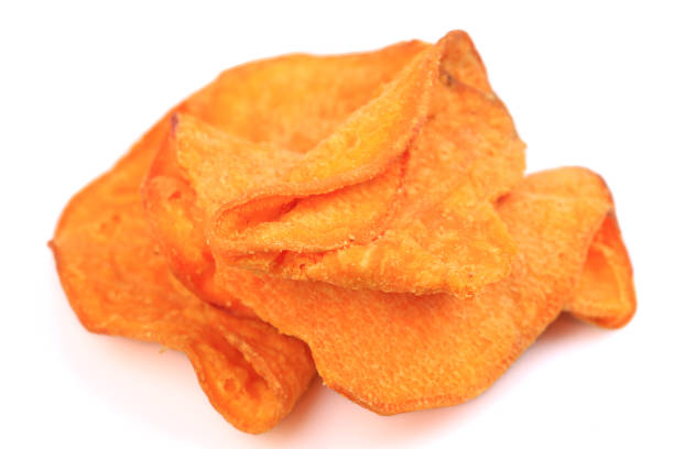 istock Tasty sweet potato chip isolated on white 1212349791