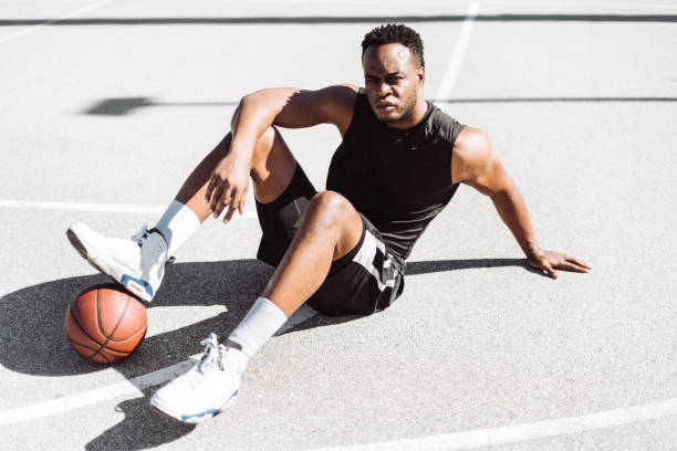 istock basketball player resting in the court 1212350541