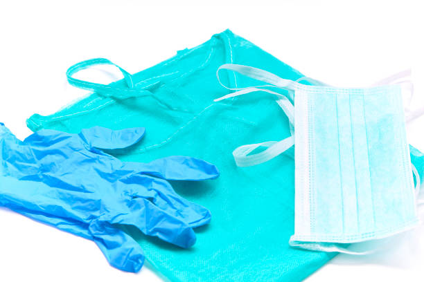 mask, gown and gloves of an emergency physician to fight the virus stock photo