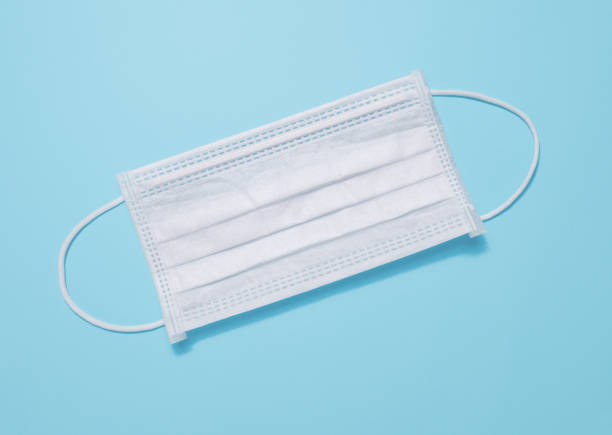Medical mask isolated on blue background