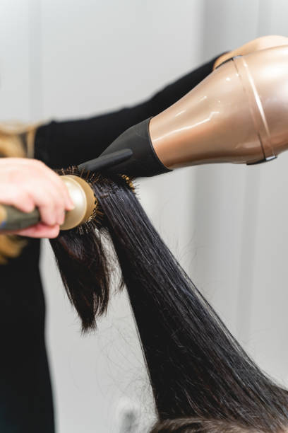 istock Focused photo on female hand that holding comb 1212352102