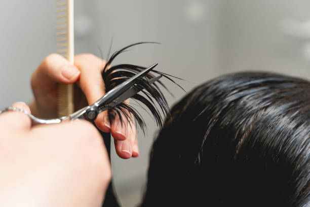 istock Close up of hands that holding scissors 1212352264