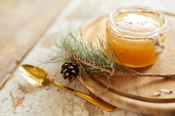 istock Honey jar on vintage wooden table. Top side view with copy space. Selective focus 1212353325