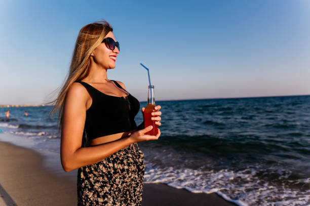 istock Woman enjoying summer vacations 1212355391