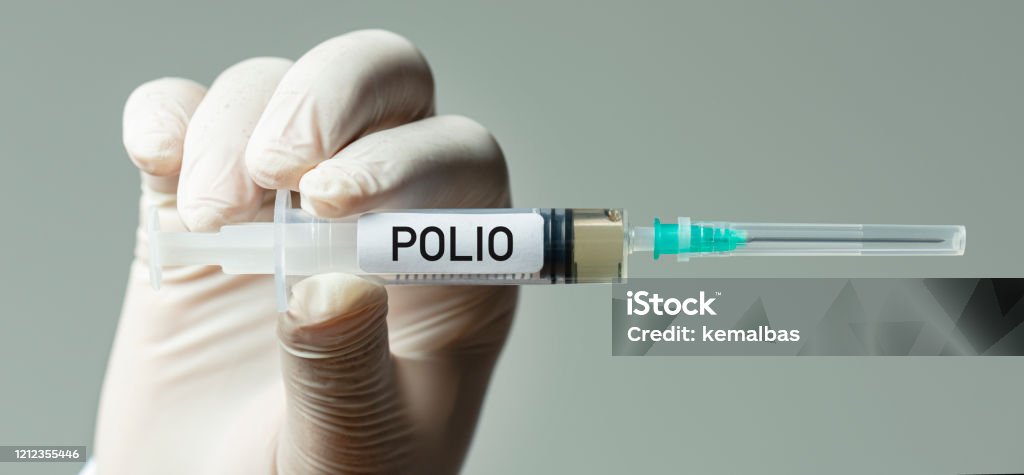 Polio Vaccine Nurse or doctor holding polio vaccine. Polio Stock Photo