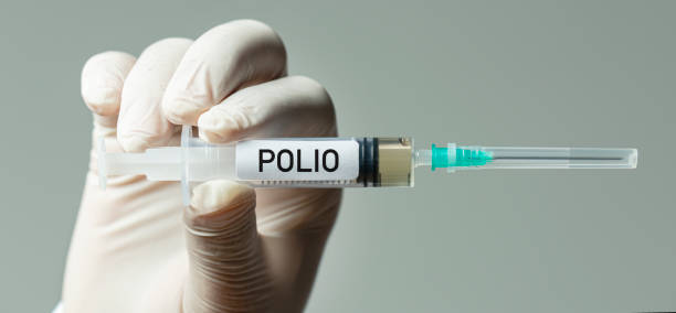 Polio Vaccine Nurse or doctor holding polio vaccine. polio vaccine stock pictures, royalty-free photos & images