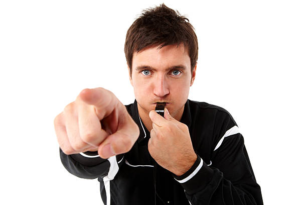 Referee Blowing His Whistle - Isolated  whistling stock pictures, royalty-free photos & images