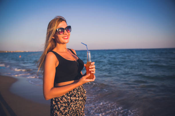 istock Woman enjoying summer vacations 1212355765