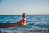 Woman's hand holding ice cream