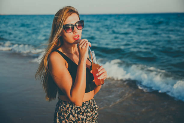 istock Young women enjoying on the beach 1212356045