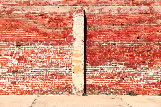 istock bright sunlit vintage red brick building wall 1212358793