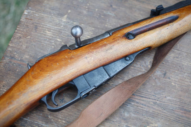 istock Rifles on wooden desk, First World War–era reenactment 1212359110