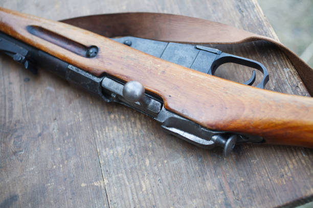 istock Rifles on wooden desk, First World War–era reenactment 1212359239