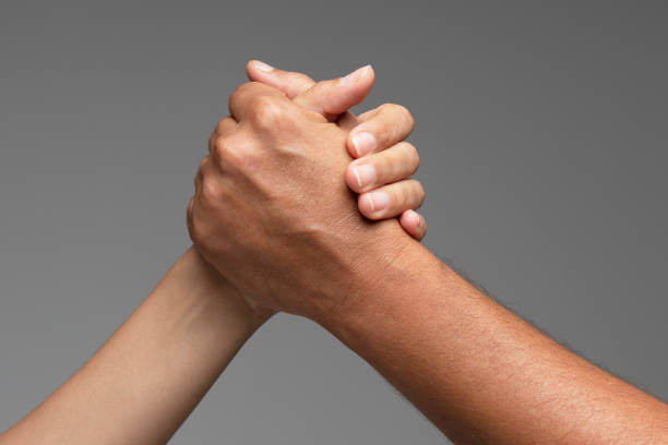 helping hand - reaching human hand handshake support imagens e fotografias de stock