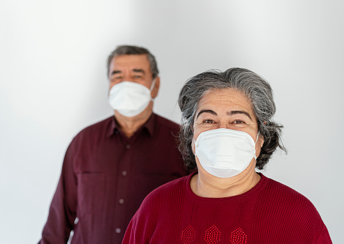 Senior couple wearing mask to prevent Covit-19