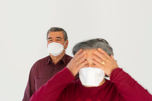Senior couple wearing mask to prevent Covit-19