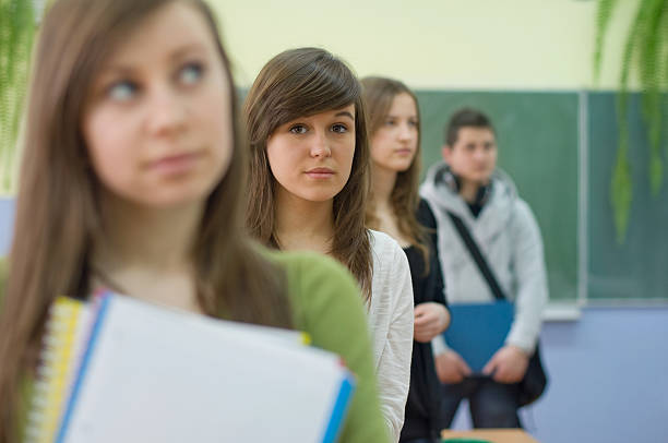 istock Teenagers in classroom 121236171