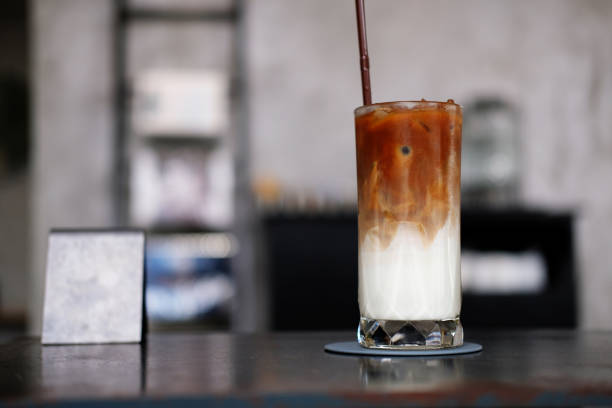 istock Iced coffee with milk on counter background 1212362798