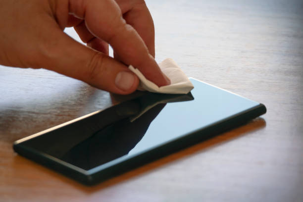 istock Cleaning up and disinfection a mobile phone. Avoiding corona virus 1212362944