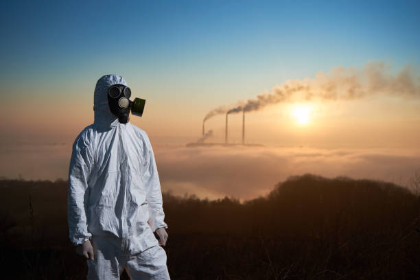 istock Scientist and smoking stacks of thermal power station 1212363040