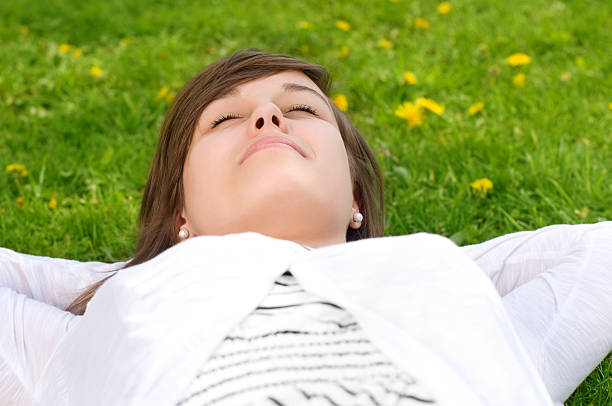 istock Beauty girl lying down of grass 121236341