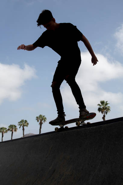 istock Silhouette of young skateboarder. 1212363466