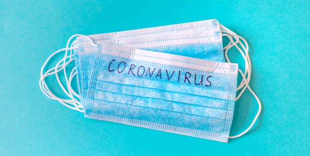 istock Coronavirus. Remedies. Masks on a blue background. Selective focus. 1212364264