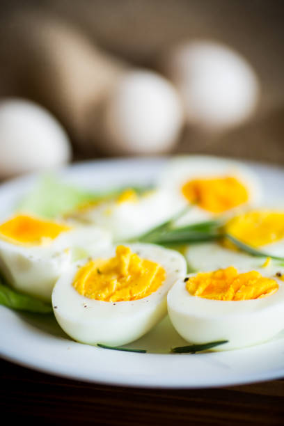 istock boiled eggs with salad leaves in a plate 1212366556