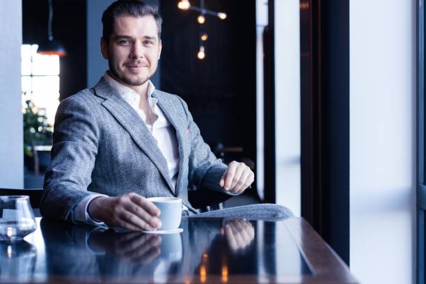 istock Business man drinking coffee in a cafe - coffee time. 1212366792