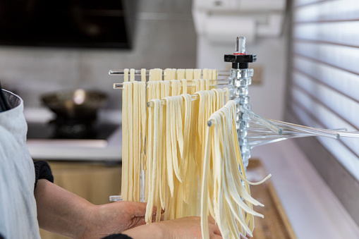 Chef preparing homemade fresh pasta.