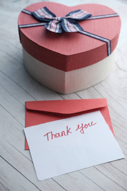 istock thank you letter with gift box on table 1212367940