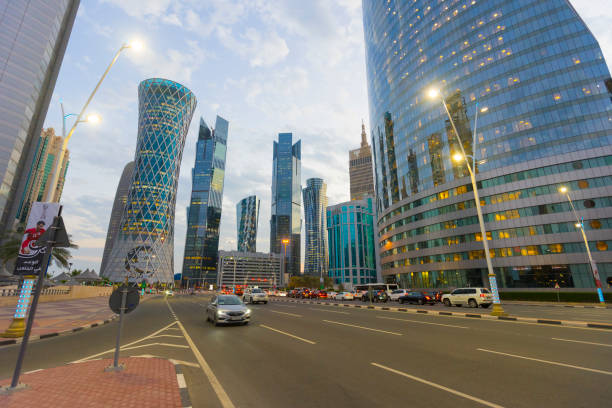 Modern skyscrapers in financial district at twilight in Doha, Qatar Doha, Qatar - November 24, 2019 : Futuristic modern skyscrapers in financial district at twilight in Doha, Qatar on November 24, 2019. qatar emir stock pictures, royalty-free photos & images