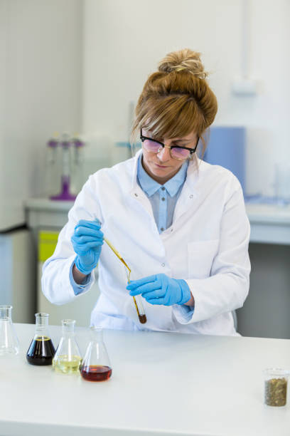 istock Chemist works with hemp CBDa oil in laboratory 1212369157