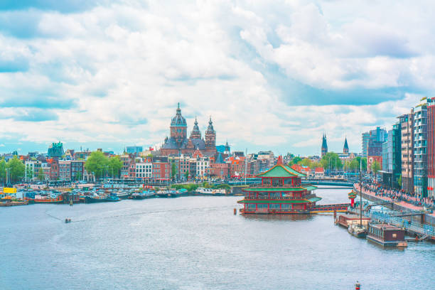 istock Channel in Amsterdam Netherlands houses river Amstel 1212369359
