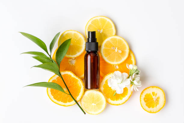 natural cosmetic image of lemon and orange - aromatic oil imagens e fotografias de stock