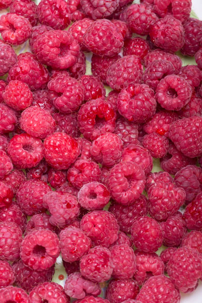 istock A beautiful selection of freshly picked ripe red raspberries. 1212371387