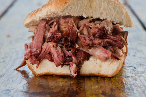 Barbecue meat sandwiches.  Brisket, beef ribs, pork ribs, bbq chicken or turkey served on traditional white hamburger buns. Traditional classic Texas style bbq.