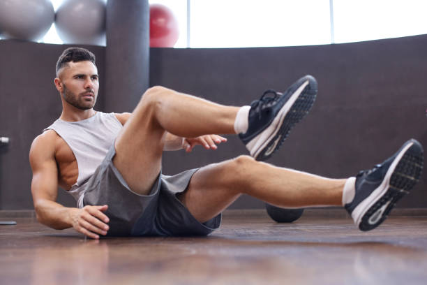 istock Sporty man stretching and warm-up doing special exercises for muscles before work his body out. 1212373789