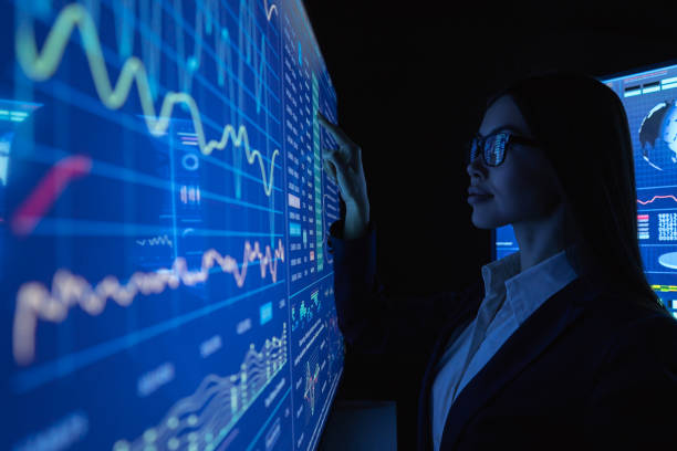 istock The businesswoman works with blue screen 1212374962