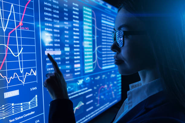 istock The businesswoman works with a blue sensor screen 1212374971